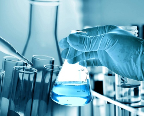 hand holding a flask